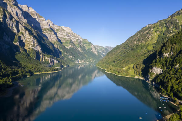 Aerial view of Klöntalersee lake at sunrise in summer. Glarus,  Canton of  Glarus, Switzerland.