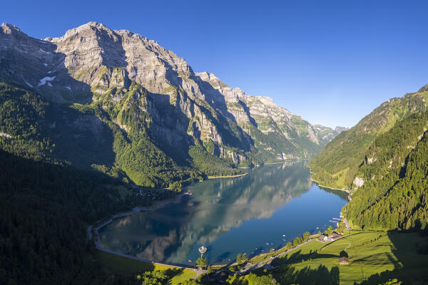 Aerial view of Klöntalersee lake at sunrise in summer. Glarus,  Canton of  Glarus, Switzerland.