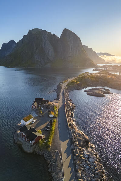Aerial view of the Hamnøya island and the Lilandstinden mountain in Reine Bay during summer sunrise at midnight sun. Lofoten Islands, Norway.