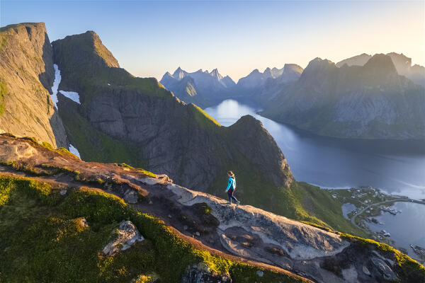 Aerial view of a sunrise at the top of Reinebringen mountain in summer during midnight sun. Reine, Moskenes, Nordland, Lofoten Islands, Norway.