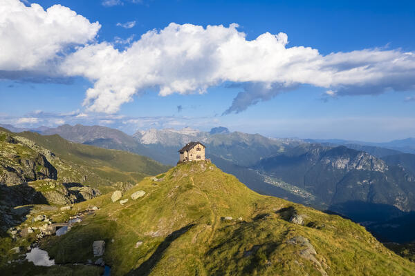 Aerial view of the Capanna Giulia Maria refuge during summer time at sunset. Valgoglio, Val Seriana, Bergamo district, Lombardy, Italy, Southern Europe.