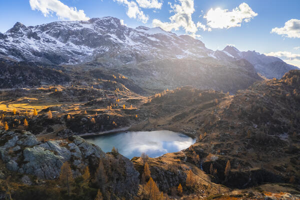 Aerial view of the Rifugio Calvi and Rotondo lake at sunset in autumn. Carona, Val Brembana, Alpi Orobie, Bergamo, Bergamo Province, Lombardy, Italy, Europe.
