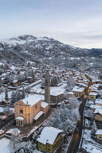 Aerial view of Castione della Presolana after a snowfall in winter. Val Seriana, Bergamo district, Lombardy, Italy.