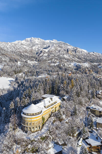 Aerial view of Castione della Presolana after a snowfall in winter. Val Seriana, Bergamo district, Lombardy, Italy.