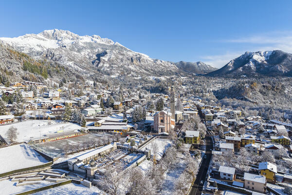 Aerial view of Castione della Presolana after a snowfall in winter. Val Seriana, Bergamo district, Lombardy, Italy.