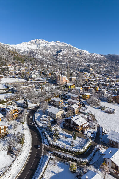 Aerial view of Castione della Presolana after a snowfall in winter. Val Seriana, Bergamo district, Lombardy, Italy.