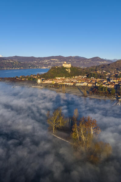 Aerial view of the fortress called Rocca di Angera during a winter sunrise with Monte Rosa in the background. Taino, Lake Maggiore, Varese district, Lombardy, Italy.