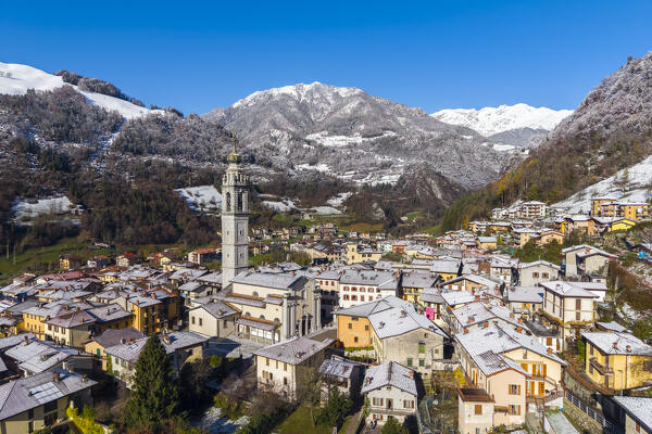 Aerial view of the beautiful village of Ardesio in winter after a snowfall. Ardesio, Orobie alps, Lombardy district, Bergamo province, Italy, Europe.