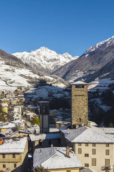 The village of Gromo with Pizzo Redorta after a snowfall in winter. Gromo, Val Seriana, Bergamo province, Lombardy, Italy, Europe.