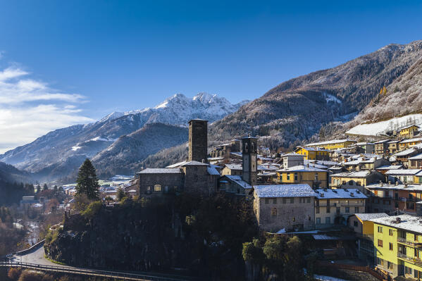 The village of Gromo with Pizzo Redorta after a snowfall in winter. Gromo, Val Seriana, Bergamo province, Lombardy, Italy, Europe.