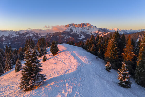 View of the Presolana during a winter sunset from Monte Pora, Val Seriana, Bergamo district, Lombardy, Italy.