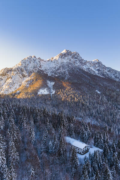 Aerial view of Zambla at sunrise after a snowfall in winter. Val Serina, Zambla Alta, Bergamo district, Lombardy, Italy, Southern Europe.