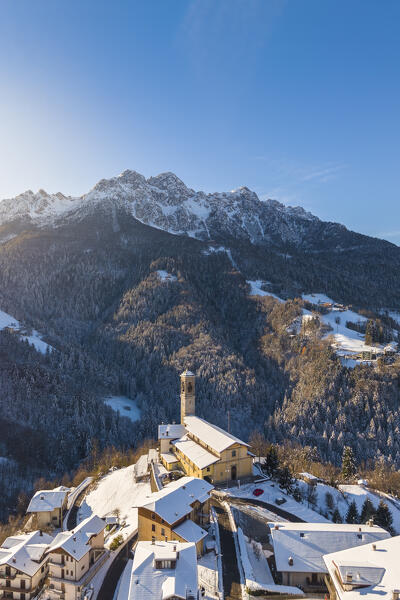 Aerial view of Zambla at sunrise after a snowfall in winter. Val Serina, Zambla Alta, Bergamo district, Lombardy, Italy, Southern Europe.