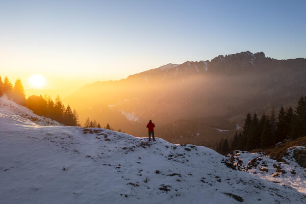 Aerial panorama of the Presolana mountain from Colle Presolana ins winter at sunset. Val Seriana, Castione della Presolana, Bergamo district, Lombardy, Italy, Southern Europe.
