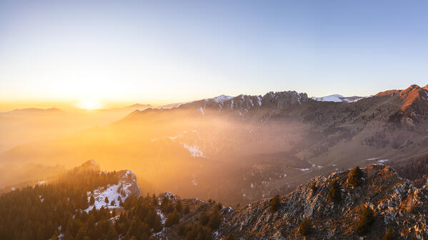 Aerial panorama of the Presolana mountain from Colle Presolana ins winter at sunset. Val Seriana, Castione della Presolana, Bergamo district, Lombardy, Italy, Southern Europe.