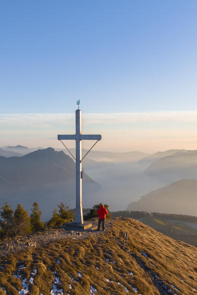 Aerial view of a winter sunset from the top of Monte Colombina looking towards Lake Iseo. Bossico, Lombardy district, Bergamo province, Italy, Europe.