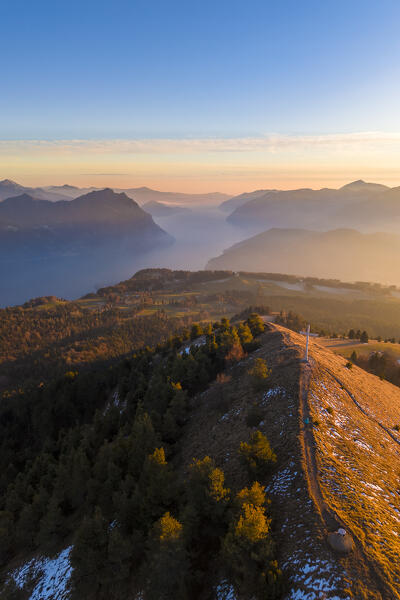 Aerial view of a winter sunset from the top of Monte Colombina looking towards Lake Iseo. Bossico, Lombardy district, Bergamo province, Italy, Europe.