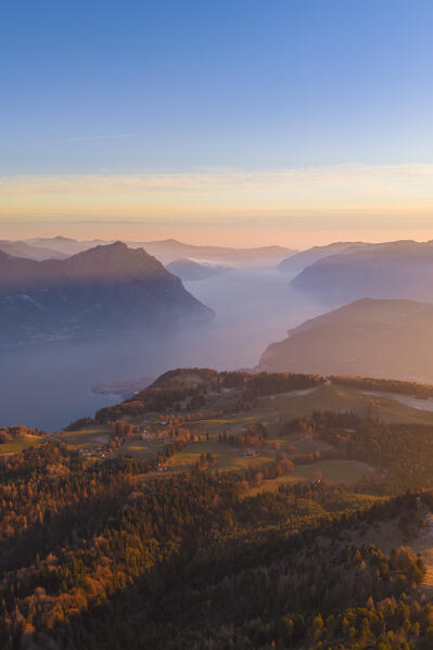 Aerial view of a winter sunset from the top of Monte Colombina looking towards Lake Iseo. Bossico, Lombardy district, Bergamo province, Italy, Europe.