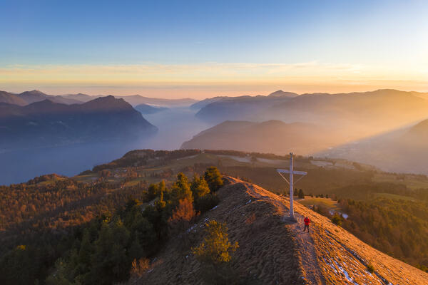 Aerial view of a winter sunset from the top of Monte Colombina looking towards Lake Iseo. Bossico, Lombardy district, Bergamo province, Italy, Europe.