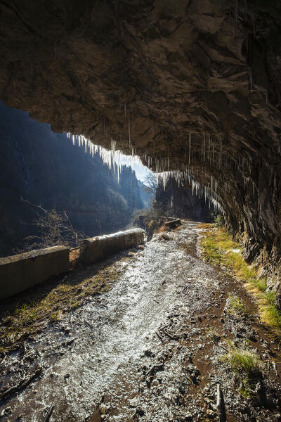 The old Via Mala di Scalve road in winter. Dezzo di Scalve, Val di Scalve, Bergamo province, Lombardy, Italy.