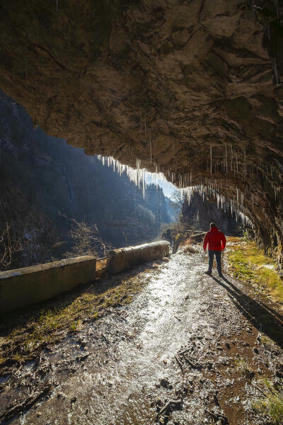 The old Via Mala di Scalve road in winter. Dezzo di Scalve, Val di Scalve, Bergamo province, Lombardy, Italy.