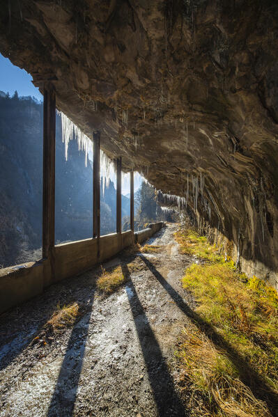 The old Via Mala di Scalve road in winter. Dezzo di Scalve, Val di Scalve, Bergamo province, Lombardy, Italy.