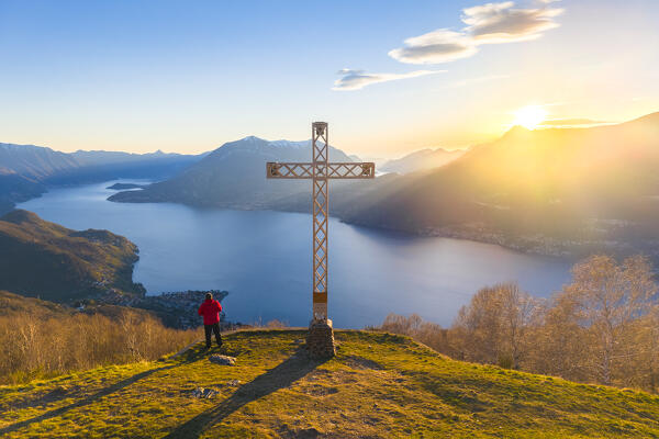 Aerial view of a sunset on Lake Como at the church of San Girolamo located in Alpe Camaggiore. Vendrogno, Bellano, Lecco province, Lombardy, Italy, Europe.