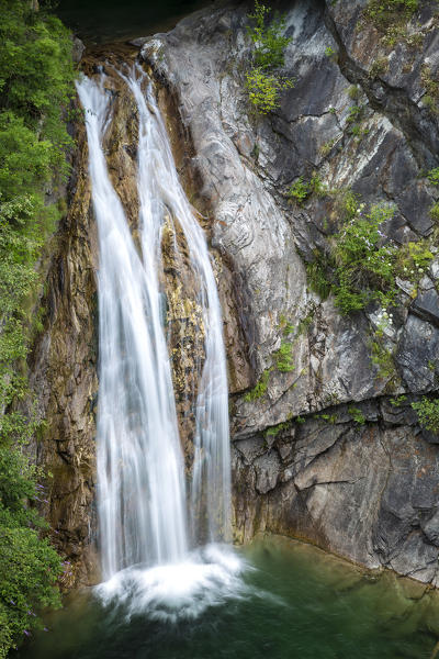 A waterfall in Messasca under the old road to Bognanco, Val Bognanco, Piedmont, Italy.