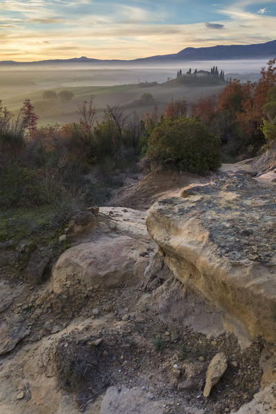 View of rocks and fields near Podere Belvedere, San Quirico d'Orcia, Val d'Orcia, Tuscany, Italy.
