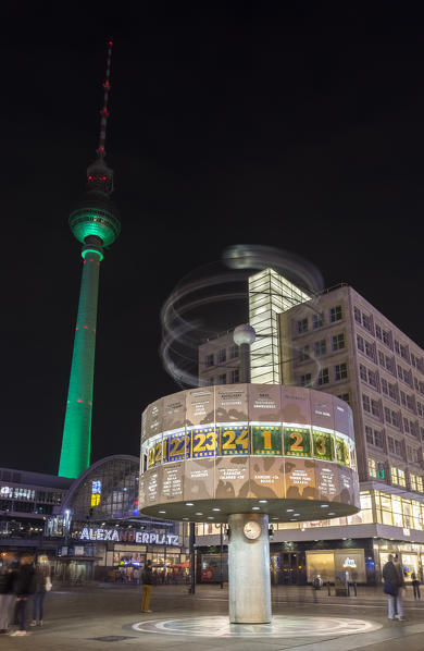 Urania Weltzeituhr clock and the Fernsehturm in Alexanderplataz, Berlin Mitte, Germany.