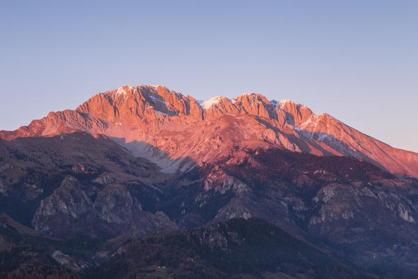 A view of the Presolana at sunset without snow from Monte Falecchio, Songavazzo, Val Seriana, Bergamo district, Lombardy, Italy.