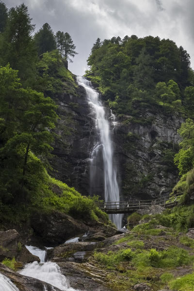 Wooden bridge under the Cascata della Froda, Sonogno, Valle Verzasca, Canton Ticino, Switzerland.