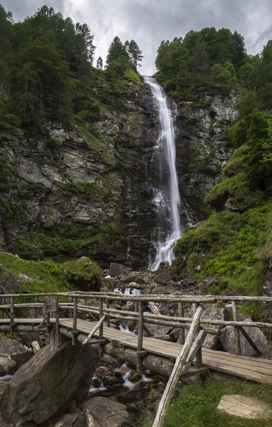 Wooden bridge under the Cascata della Froda, Sonogno, Valle Verzasca, Canton Ticino, Switzerland.