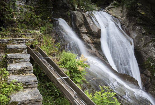 The double waterfall near the Frasco mill, on the river Efra in the town of Frasco, Valle Verzasca, Canton Ticino, Switzerland.