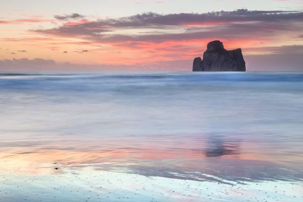Sunset at Masua beach, in front of the Pan di Zucchero reef. Masua, Sulcis-iglesiente, Iglesias, Sardinia, Italy.