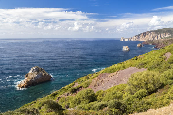 View of the coast near Masua, in the distance the Pan di Zucchero reef. Masua, Sulcis-iglesiente, Iglesias, Sardinia, Italy.