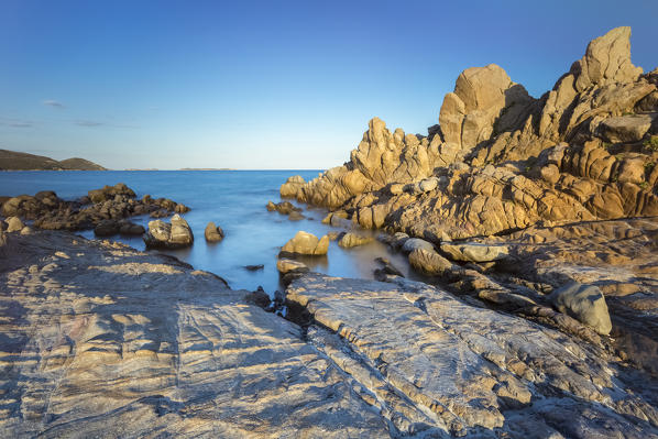 Sunset on the rocks of Timi Ama beach, near Porto Giunco, Villasimius, Cagliari, Sardinia, Italy, Europe.