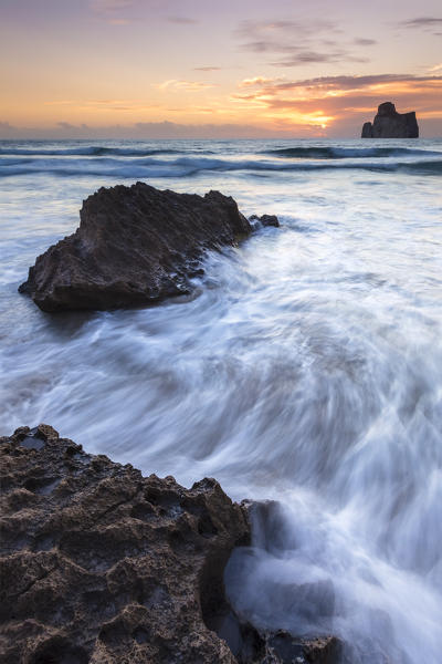 Sunset at Masua beach, in front of the Pan di Zucchero reef. Masua, Sulcis-iglesiente, Iglesias, Sardinia, Italy.