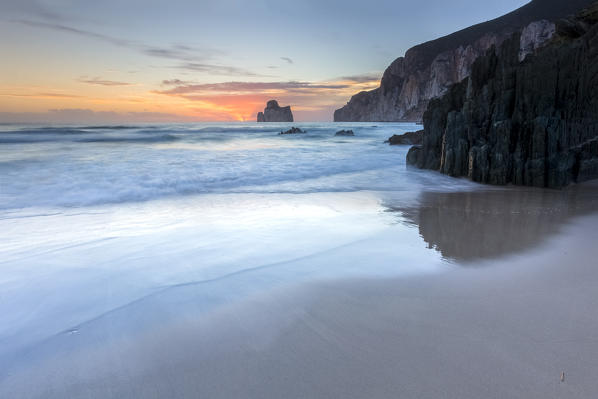 Sunset at Masua beach, in front of the Pan di Zucchero reef. Masua, Sulcis-iglesiente, Iglesias, Sardinia, Italy.
