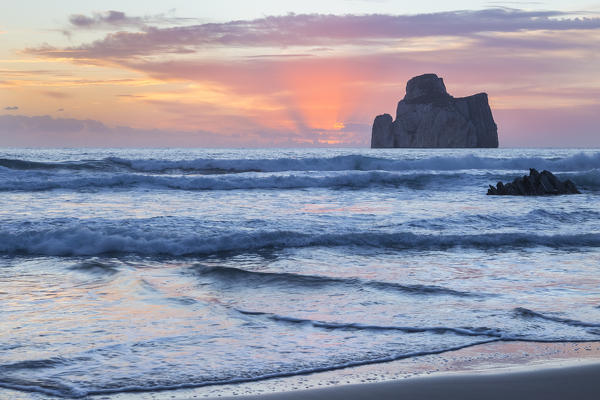 Sunset at Masua beach, in front of the Pan di Zucchero reef. Masua, Sulcis-iglesiente, Iglesias, Sardinia, Italy.
