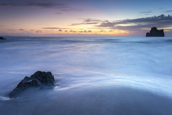 Sunset at Masua beach, in front of the Pan di Zucchero reef. Masua, Sulcis-iglesiente, Iglesias, Sardinia, Italy.