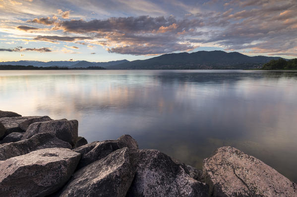 A summer sunset reflecting on Lake Varese at Cazzago Brabbia harbour, Varese Province, Lombardy, Italy.