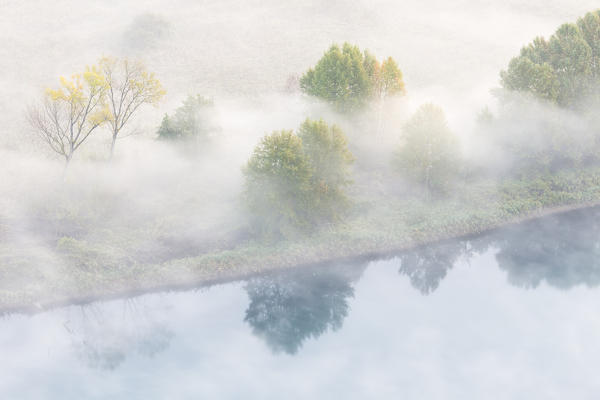Mist over Adda river seen from Airuno at the Santuario Madonna della Rocchetta, Airuno, Parco dell'Adda Nord, Lecco province, Brianza, Lombardy, Italy.