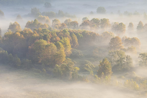 Mist over Adda river seen from Airuno at the Santuario Madonna della Rocchetta, Airuno, Parco dell'Adda Nord, Lecco province, Brianza, Lombardy, Italy.