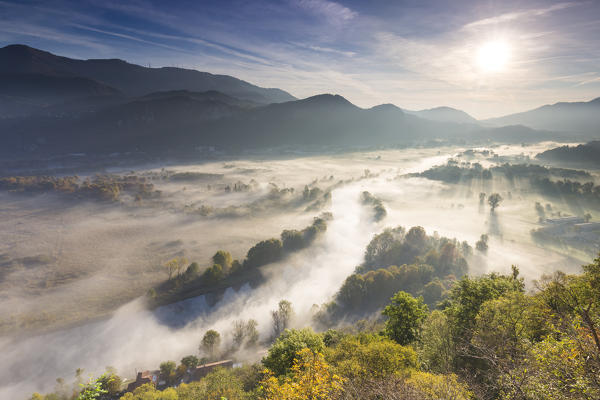 Mist over Adda river seen from Airuno at the Santuario Madonna della Rocchetta, Airuno, Parco dell'Adda Nord, Lecco province, Brianza, Lombardy, Italy.