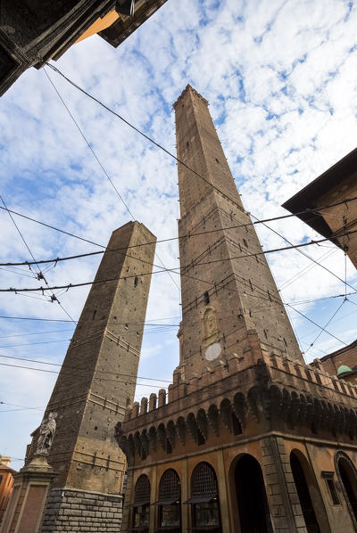 View of the Torre degli Asinelli and Torre della Garisenda from Piazza di Porta Ravegnana square. Bologna, Emilia Romagna, Italy.