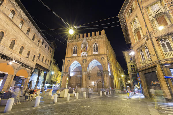 View of the Palazzo della Mercanzia from Piazza della Mercanzia square at night. Bologna, Emilia Romagna, Italy.