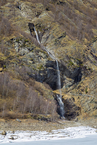 Catwalk under the Sajont waterfall on the trail around Lago di Antrona, Antrona Valley, Piedmont, Italy.