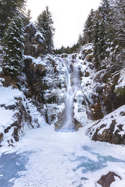 Vo' waterfall near Schilpario iced in winter. Val di Scalve, Bergamo province, Lombardy, Italy.