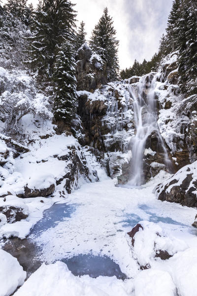 Vo' waterfall near Schilpario iced in winter. Val di Scalve, Bergamo province, Lombardy, Italy.
